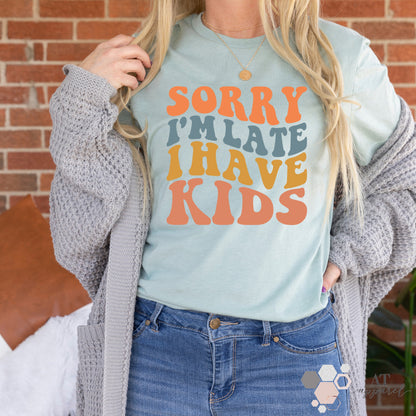 Woman wearing Sorry I'm Late I Have Kids Tee in heather dusty blue