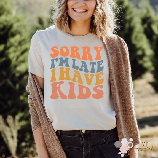 Woman wearing Sorry I'm Late I Have Kids Tee in heather natural